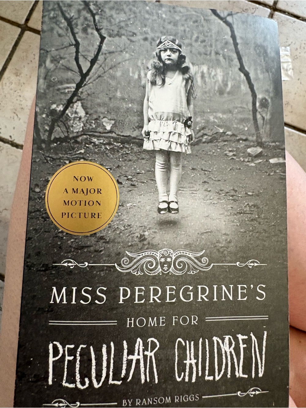Scholastic Black & White Paperback Cover with Gold Sticker